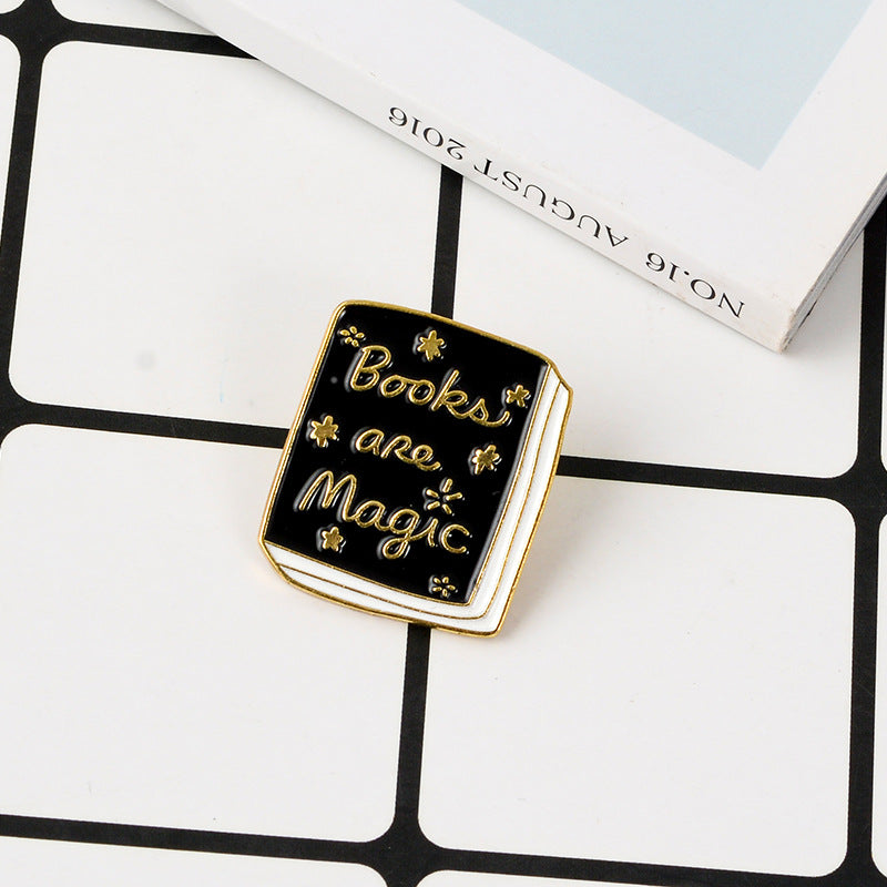 Various "Book" pins.  Brooch